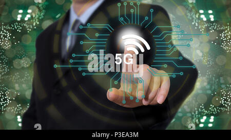 Businessman on blurred background using 5G network Stock Photo