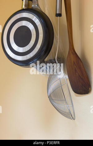 DIY tools kitchen holding on wall, ready for cooking. Stock Photo