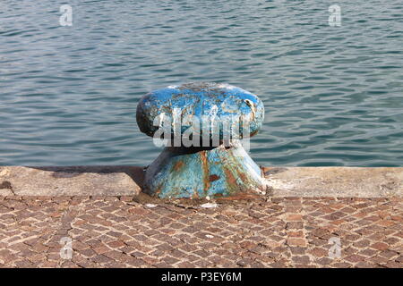 Detailed view of an iron dock cleat in a harbour Stock Photo