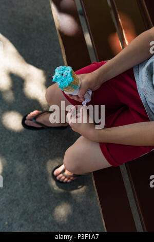 Low section of boy having ice cream Stock Photo