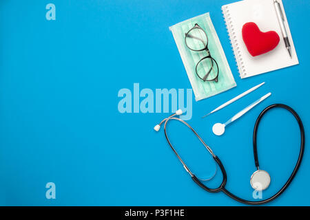 Flat lay aerial image of tools medical & Healthcare background concept.Table top view essential items for doctor using treat & care patient in hospita Stock Photo