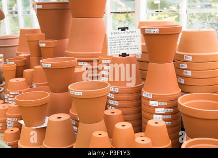 Display of terracotta pots on sale, The Walled garden plant nursery, Benhall, Suffolk, England, UK Stock Photo