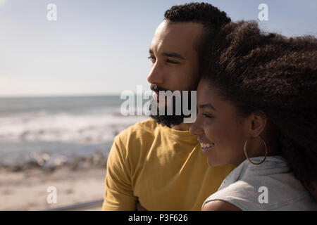 Couple standing on a beach Stock Photo