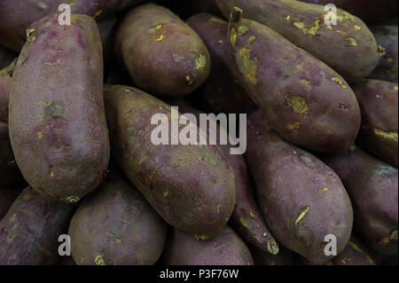 Food background - closeup of purple yams at the farmers market Stock Photo