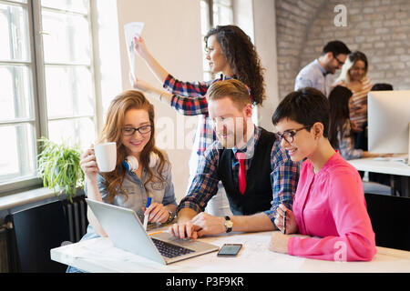 Group of young architects working on computer Stock Photo