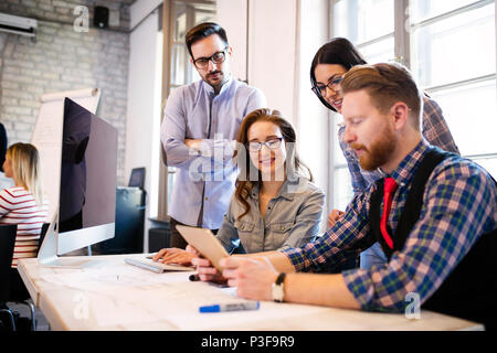 Group of young architects using digital tablet Stock Photo