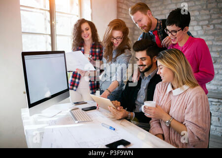 Group of young architects using digital tablet Stock Photo
