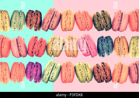 Colorful rows macarons on vintage pastel  background Stock Photo