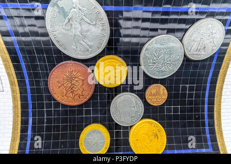 Pont Neuf station on The Paris Metro , decorated with huge coins on the walls and ceilings to advertise the nearby Monnaie de Paris / Museum of Money Stock Photo