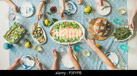 Family or friends having seafood summer dinner Stock Photo