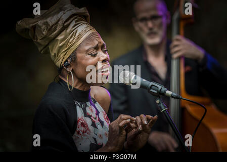 Ley Adewole lead vocalist with the The Grace Notes performing at Trebah Garden amphitheatre in Cornwall. Stock Photo