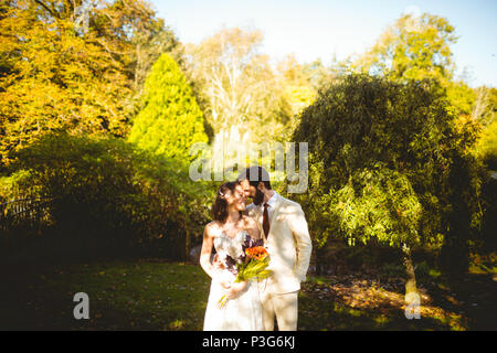 Romantic bride and groom embracing each other Stock Photo