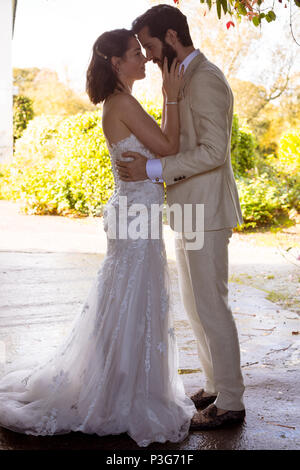 Bride and groom looking into each others eyes Stock Photo