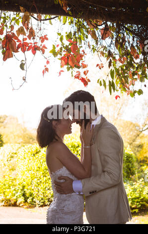Bride and groom looking into each others eyes Stock Photo