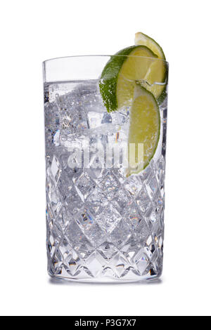 A refreshing gin and tonic coctail in a crystal galsss, shot on white with a small reflection Stock Photo