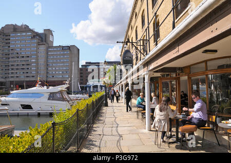 Cafés and restaurants along the marina at St Katharine Docks, Tower Hamlets, London, England, UK Stock Photo