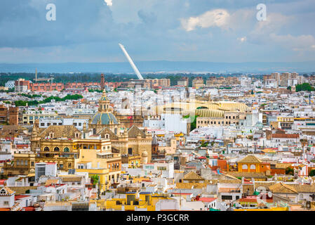 Seville Old City, aerial view of the old town quarter in Seville (Sevilla) with Las Setas and the Puente del Alamillo visible in the distance, Spain. Stock Photo