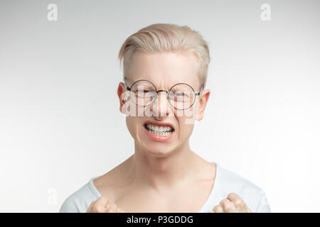 Outraged man gestures angrily, being irritated, outraged Stock Photo