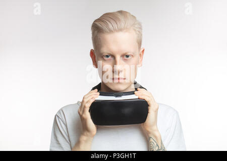 Happy man getting experience using VR headset glasses of virtual reality, isolated on white background Stock Photo