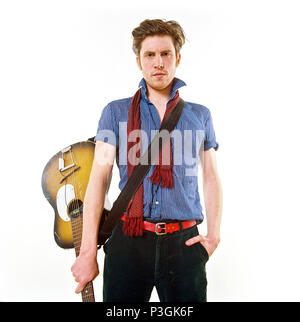 Charlie Waller lead singer of The Rumble Strips band, photographed against a white studio background, Old Street, London, England, United Kingdom. Stock Photo