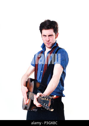 Charlie Waller lead singer of The Rumble Strips band, photographed against a white studio background, Old Street, London, England, United Kingdom. Stock Photo