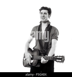 Charlie Waller lead singer of The Rumble Strips band, photographed against a white studio background, Old Street, London, England, United Kingdom. Stock Photo