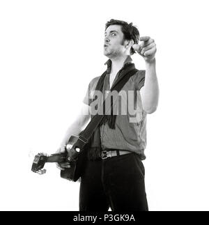 Charlie Waller lead singer of The Rumble Strips band, photographed against a white studio background, Old Street, London, England, United Kingdom. Stock Photo