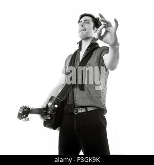 Charlie Waller lead singer of The Rumble Strips band, photographed against a white studio background, Old Street, London, England, United Kingdom. Stock Photo