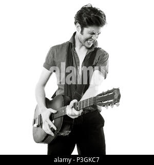 Charlie Waller lead singer of The Rumble Strips band, photographed against a white studio background, Old Street, London, England, United Kingdom. Stock Photo