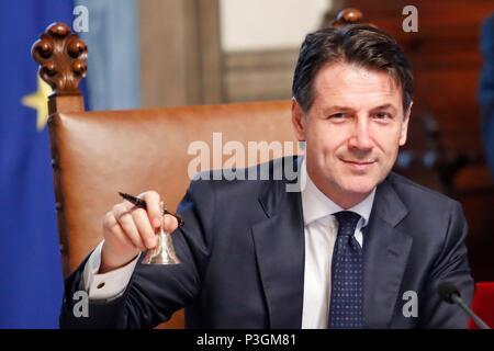 New italian Premier Giuseppe Conte rings the bell to mark the start of the first  cabinet meeting of the new government at the Chigi Palace in Rome, I Stock Photo