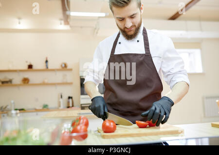 Professional Chef Cooking in Restaurant Stock Photo