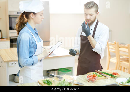 Two Chefs in Restaurant Kitchen Stock Photo