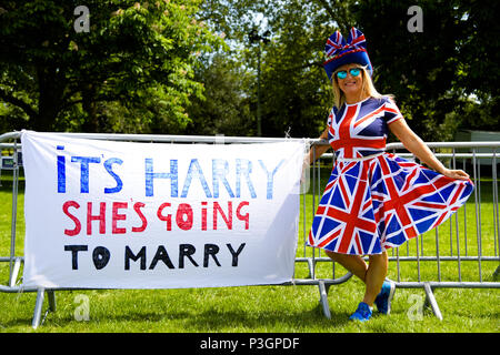 Pauline Jones wearing a Union Jack dress poses beside a banner reading  'It's Harry she's going to marry' ahead of the Royal Wedding in Windsor,  Berkshire. Featuring: Pauline Jones Where: Windsor, Berkshire,