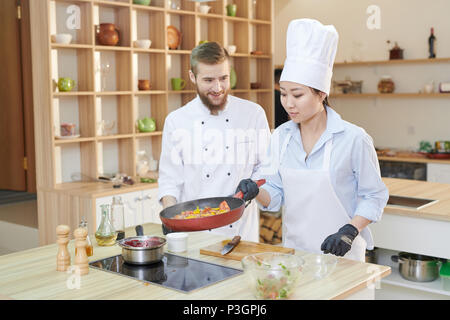 Two Professional Chefs at Work Stock Photo