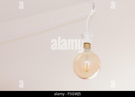 Philadelphia, Pennsylvania May 25 2018: Yellow light bulb hanging on the roof Stock Photo