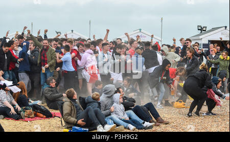 Brighton UK 18th June 2018 - Thousands of England football fans celebrate the first goal as they watch the match on a giant screen on Brighton seafront as they play against Tunisia in the World Cup being held in Russia Stock Photo