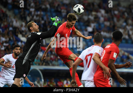 Volgograd, Russia. 18th June, 2018. Volgograd, Russia.  Soccer: World Cup, Tunisia vs England, preliminary round, group G, Volgograd Stadium. Tunisia goalkeeper Farouk Ben Mustapha (2nd from left) and England's John Stones (C) vying for the ball. Credit: Andreas Gebert/dpa/Alamy Live News Credit: dpa picture alliance/Alamy Live News Stock Photo