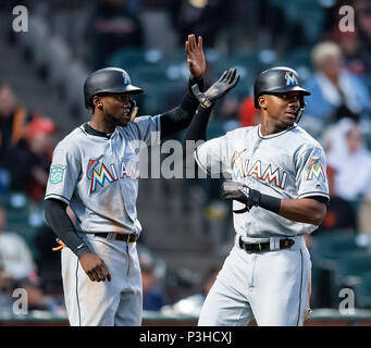 San Francisco Giants' Lewis Brinson, in front, reacts after