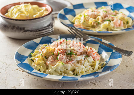 Shrimp Fettuccine Alfredo. Pasta in cheese and butter sauce with prawns. Stock Photo