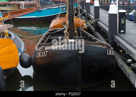 URK, NETHERLANDS - MAY 19, 2018: traditional wooden fishing boats in the harbor of Urk. Urk is on of the best-known fishing villages in the country wi Stock Photo