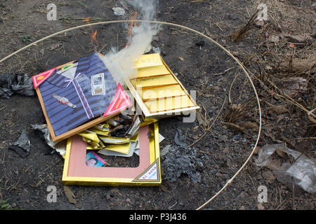 Burning paper clothes in Ching Ming festival for ancestor Stock Photo