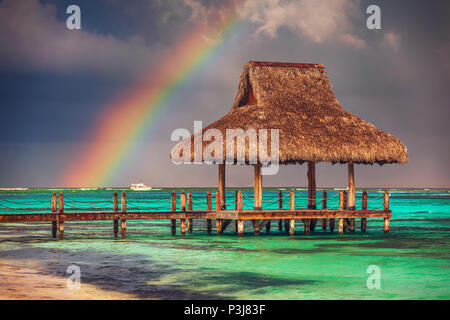 Rainbow over the  Wooden Water Villa  in Cap Cana, Dominican Republic. Stock Photo