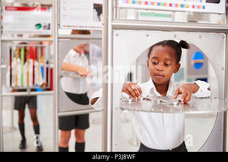 School kids taking part in science tests at a science centre Stock Photo