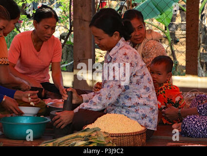 The day before a Cambodian wedding the family prepares for the celebration and cooking takes place all day. Stock Photo