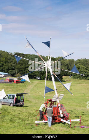 Chepstow, Wales – Aug 14: A mobile windmill wind generator sets up on 14 Aug 2016 at the opening of the Green Gathering Festival Stock Photo