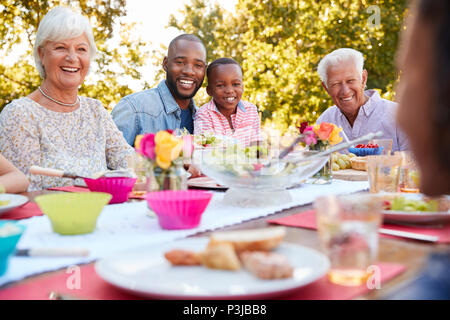 Friends having a lunch party in the garden Stock Photo