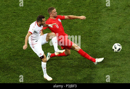 Tunisia's Ali Maaloul (left) and England's Jordan Henderson battle for the ball during the FIFA World Cup Group G match at The Volgograd Arena, Volgograd. Stock Photo