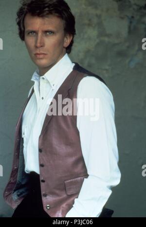 Year: 1984.  Stars: PETER WELLER. Stock Photo