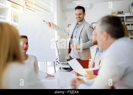 Presentation and collaboration by business people Stock Photo