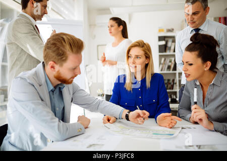 Coworkers working on project together Stock Photo